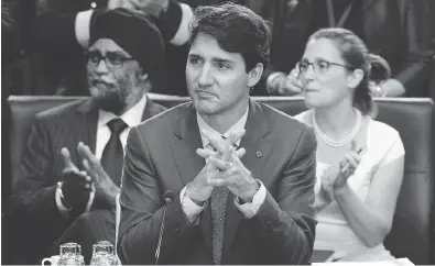  ?? SEAN KILPATRICK / THE CANADIAN PRESS ?? Prime Minister Justin Trudeau, Defence Minister Harjit Sajjan and Foreign Affairs Minister Chrystia Freeland take part in North Atlantic Council working session at the NATO summit in Brussels on Wednesday.