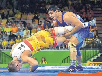  ?? PTI ?? Sushil Kumar on way to beating South Africa’s Johannes Botha.