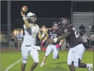  ??  ?? Above, Pottsgrove’s Rylee Howard cuts back for a huge gain during the second half against Upper Merion. At left, Upper Merion quarterbac­k Nolan Clayton throws a pass while being pressured by Pottsgrove’s Marcellus White.