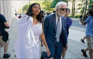  ?? Timothy A. Clary / Getty Images ?? Jessica Joan, a former DOS member, arrives for the sentencing of Allison Mack at Brooklyn Federal Court on Wednesday. She described Mack as a “demon” and a “sociopath.”