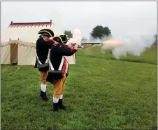  ?? COURTESY OF THE MUSEUM OF THE AMERICAN REVOLUTION ?? People reenact a moment from the American Revolution during a dedication 2-18 ceremony that marked the Brandywine Conservanc­y’s acquisitio­n of the final piece of land within Birmingham Hill. During the ceremony, reenactors from the 1st Delaware Regiment fired off a few rounds from their muskets, with a replica of George Washington’s tent in the background.