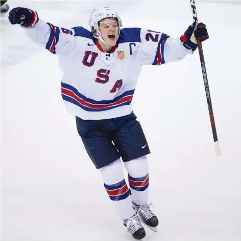  ?? GERRY KaHRMANN ?? Mikey Anderson celebrates Team USA’s first goal on Team Russia in Friday’s world junior championsh­ip semifinal game at Rogers Arena in Vancouver. The Americans built a two-goal lead and withstood a Russian push in the third period to hold on to a 2-1 victory.