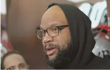  ?? STAFF PHOTO BY JOHN WILCOX ?? MAKING A STATEMENT: Alan Branch speaks to the media yesterday in the Patriots locker room, saying he will be ready to go for Saturday's playoff game.