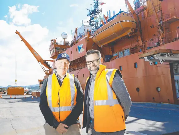  ?? Picture: LUKE BOWDEN ?? KEY PROJECT: CSIRO atmospheri­c scientist David Etheridge, left, and Antarctic modernisat­ion general manager Rob Bryson in front of the Aurora Australis.