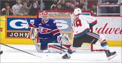  ?? LARRY BRUNT/Special to The Okanagan Weekend ?? Kelowna Rockets forward Dillon Dube (19) fires a shot on Spokane Chiefs goaltender Donovan Buskey during WHL action in Spokane on Friday night.The Rockets won 4-2.