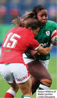  ??  ?? Robyn Wilkins of Wales tackles Linda Djougang