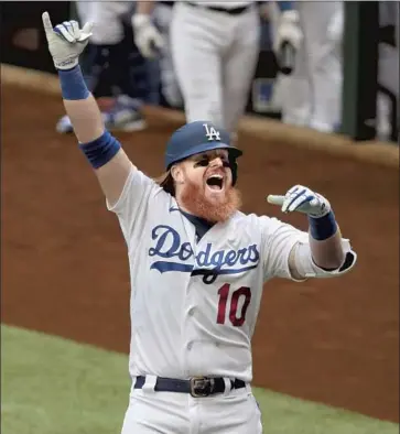  ?? Robert Gauthier Los Angeles Times ?? JUSTIN TURNER was signed to a minor league deal in 2014 and became the Dodgers’ career postseason leader in several offensive categories. At 36, he is reported to be seeking a three- year contract.