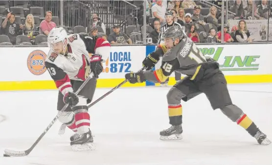  ?? GETTY IMAGES ?? Erik Brannstrom (12), racing after the Coyotes’ Vinnie Hinostroza during a preseason game with the Golden Knights, was assigned to the Wolves to work on his defense.