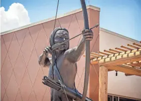  ?? PROVIDED ?? The bronze sculpture “Tvshka Homma,” the “Red Warrior,” by Kingfisher artist John Gooden, watches over the entry of the Choctaw Cultural Center in Calera, near Durant.