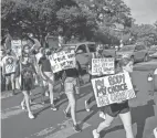  ?? JAY JANNER/AMERICAN-STATESMAN ?? University of Texas students march to the Capitol in Austin on Tuesday to protest the ban on abortions after six weeks.