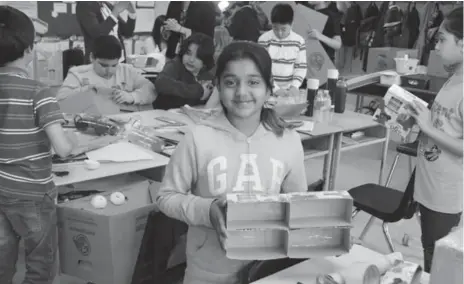  ?? CATHERINE PORTER/TORONTO STAR ?? Sadia Samoon, 10, shows the progress on her “bee hotel” for solitary foraging bees that have strayed too far from their hive. Her Grade 5 classroom at Munden Park J.S. in Mississaug­a has been studying bees since one died in their portable last September.