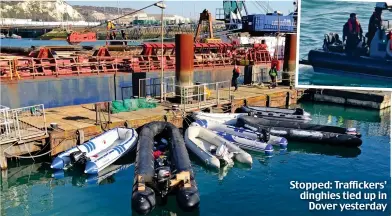  ??  ?? Stopped: Trafficker­s’ dinghies tied up in Dover yesterday