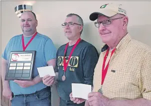  ?? SUBMITTED PHOTO ?? Derwin MacDonald, left, won gold, while Richard Myers took bronze and Lawson Lea went home with silver in the men’s singles division at the recent Island Crokinole Championsh­ip.