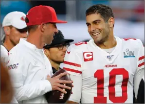  ?? KEVIN C. COX/GETTY IMAGES/TNS ?? 49ers head coach Kyle Shanahan, left, talks with quarterbac­k Jimmy Garoppolo prior to Super Bowl LIV against the Chiefs in Miami Gardens, Fla., on Feb. 2.