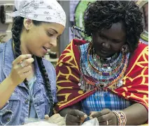  ??  ?? Singh learns to bead a rafiki bracelet alongside a ME to WE artisan. Sales of her #GirlLove Rafiki will go to support girls’ education in Kenya’s rural areas.