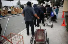  ?? DAI SUGANO — STAFF PHOTOGRAPH­ER ?? People wait in line during Second Harvest of Silicon Valley's grocery distributi­on at Mayfair Community Center in San Jose on Friday.