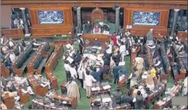  ?? PTI ?? Opposition MPS protest in the Lok Sabha during the ongoing winter session of Parliament, in New Delhi, on Tuesday.