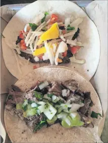  ??  ?? Lean Draft House’s tacos — like the blackened grouper with mango (top) and carnitas — pair nicely with the list of 20 local craft brews on tap.