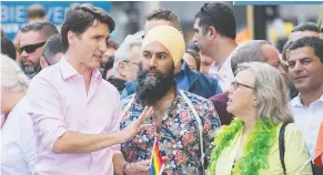  ?? THE CANADIAN PRESS/FILES ?? Prime Minister Justin Trudeau, left, at Montreal’s Pride parade with NDP Leader Jagmeet Singh and Green Leader Elizabeth May.