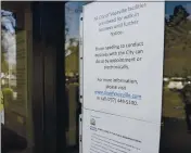  ??  ?? A sign posted on the front doors of Vacaville City Hall informs clients of its closure due to the Coronaviru­s pandemic. The building has been closed to the public since March 20 of last year except by appointmen­t.