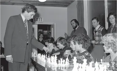  ??  ?? Former world junior chess champion Alexander Belyavsky took on 30 members of Maidenhead Chess Club at the same time in 1975. Ref:132383-1