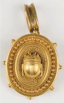  ?? ?? A Victorian gold oval pendant brooch, circa 1865, with a central scarab motif