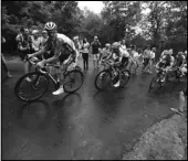  ?? Associated Press ?? WET RACE France’s Thibaut Pinot, left, Colombia’s Egan Bernal and France’s Julian Alaphilipp­e climb Prat d’Albis during the 15th stage of the Tour de France on Sunday.