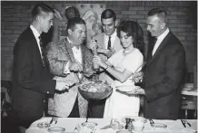  ??  ?? From the Dec. 23, 1960, Chronicle: Entertaine­rs at Sir-Loin House. Songstress Joanne Sommers seasons a salad as she and the Wanderers Three get ready to dine at Sonny Look’s Sir-Loin House Restaurant on Westheimer. Joanie and the members of the...