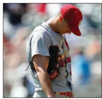  ?? AP/JOHN BAZEMORE ?? St. Louis pitcher Jack Flaherty waits for Manager Mike Shildt to make his way to the mound in Wednesday’s 7-3 loss to the Atlanta Braves. Flaherty allowed a season-high five runs in the loss.