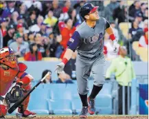  ?? MARK J. TERRILL THE ASSOCIATED PRESS ?? United States’ Ian Kinsler watches his two-run home run against Puerto Rico during the third inning of the final of the World Baseball Classic.