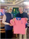  ??  ?? Shane Warne presented a Rajasthan Royal jersey and a team cap to the museum