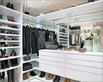  ?? LA CLOSET DESIGN ?? Closet guru Lisa Adams suggests designer touches, such as a mirrored back wall, to customize even a standard-issue closet. Steal ideas from the kitchen: Use all the space: Make it pretty: