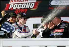  ?? MATT SLOCUM — THE ASSOCIATED PRESS ?? Ryan Blaney celebrates in Victory Lane after winning the NASCAR Cup Series Pocono 400 auto race, Sunday in Long Pond, Pa.