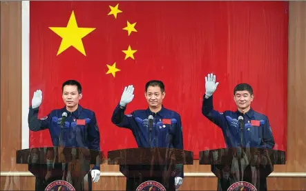  ?? SU DONG / FOR CHINA DAILY ?? Astronauts (left to right) Tang Hongbo, Nie Haisheng and Liu Boming — crew of the Shenzhou XII spacecraft — attend a news conference at the Jiuquan Satellite Launch Center on Wednesday. They are scheduled to be sent into space on Thursday morning.