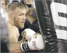  ?? JOHN LOCHER — THE ASSOCIATED PRESS ?? UFC champion Conor McGregor, training during a recent media workout in Las Vegas, will face undefeated boxing champion Floyd Mayweather Jr. tonight.