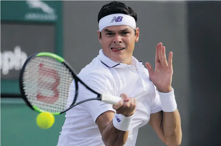  ?? — THE ASSOCIATED PRESS ?? Milos Raonic returns serve to Germany’s Alexander Zverev at Wimbledon on Monday. Raonic won and will face Roger Federer in the quarter-finals.