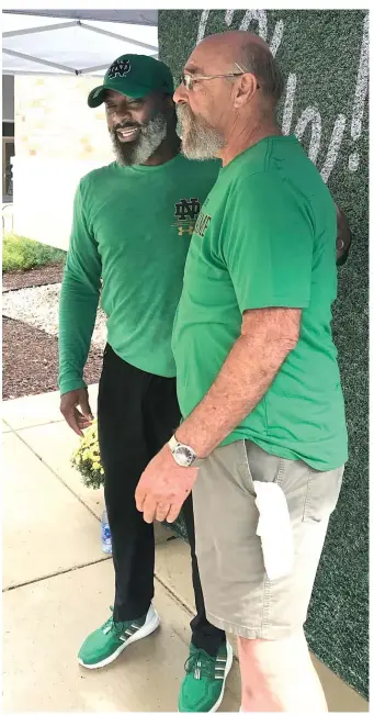  ?? MIKE BERARDINO/SUN-TIMES ?? Raghib “Rocket” Ismail (left) has been following the exploits of Chris Tyree, the latest to wear his No. 25 for Notre Dame.