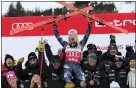  ?? ALESSANDRO TROVATI — THE ASSOCIATED PRESS ?? Mikaela Shiffrin holds her skis as she celebrates her record-tying 86th career win in Are, Sweden on Friday.