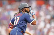  ?? Isaiah J. Downing-USA TODAY Sports ?? American League first baseman Vladimir Guerrero Jr. of the Toronto Blue Jays celebrates as he rounds the bases after hitting a home run against the National League on July 13.