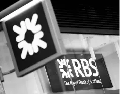  ??  ?? Royal Bank of Scotland signs are seen at a branch of the bank, in London. The government alleges RBS misled investors in underwriti­ng and issuing residentia­l mortgage-backed securities, understati­ng the risks behind many of the loans and providing inaccurate data. — Reuters photo