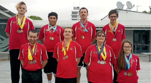  ??  ?? Back row, from left, Gary Albright, Bronson WilliamsEl­liot, Donald Williams, Tom Rogers and front row, from left, Wilson Stock, Logan O’Connor, Toni Tawhai, and Samantha Brothwood-McKee at the Special Olympics Trans Tasman Tournament last month.