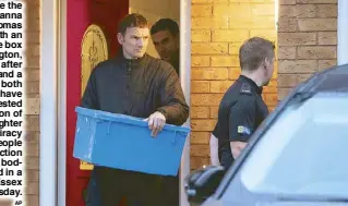  ?? AP ?? Police leave the home of Joanna and Thomas Maher with an evidence box in Warrington, Cheshire, after a man and a woman, both aged 38, have been arrested on suspicion of manslaught­er and conspiracy to traffic people in connection with the 39 bodies found in a lorry in Essex on Wednesday.