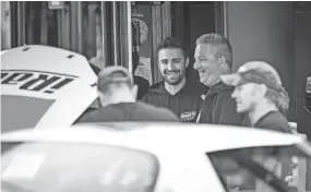  ?? DAVE KALLMANN / MILWAUKEE JOURNAL SENTINEL ?? Ty Majeski and team owner Brad Mannstedt share a laugh before practice at the Jim Sauter Classic on Saturday.