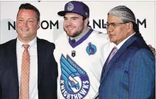  ?? SPECIAL TO THE ST. CATHARINES STANDARD ?? St. Catharines Jr. A Athletics goaltender Nick Damude, centre, is flanked by Rochester Knighthawk­s head coach Stuart Brown, left, and Curt Styres, the National Lacrosse League team’s owner.