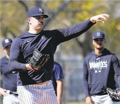  ?? AP ?? Yanks hope to have Carlos Rodon back sometime in April after new lefty suffers mild forearm strain.