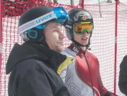  ??  ?? Erik Read, right, and his father, Ken, look at the final racers of the men’s giant slalom at Beaver Creek on Friday. Maxwell Benz, University of Colorado