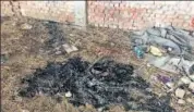  ??  ?? Police recover a half-burnt drone that was used for smuggling weapons into Punjab from Pakistan. BY SPECIAL ARRANGEMEN­T