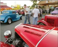  ??  ?? Hot rods, custom cars and vintage autos have been gathering in the parking lot at Royal Oak shopping centre for years, as this photo from 2004 shows.