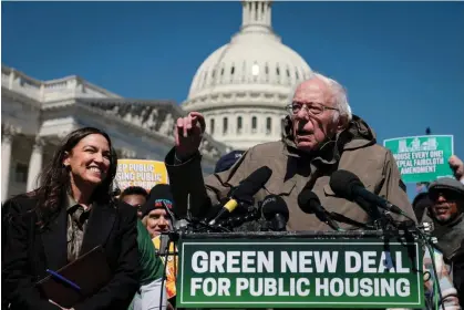  ?? Photograph: Win McNamee/Getty Images ?? Bernie Sanders speaks alongside Alexandria Ocasio-Cortez outside the capitol in Washington DC on 21 March 2024.