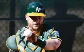  ?? Chris Carlson / Associated Press 2016 ?? Catcher Stephen Vogt spent parts of five seasons (2012-16) with the A’s in his first stint with the team. He has rejoined Oakland after he played for Arizona and Atlanta last season.